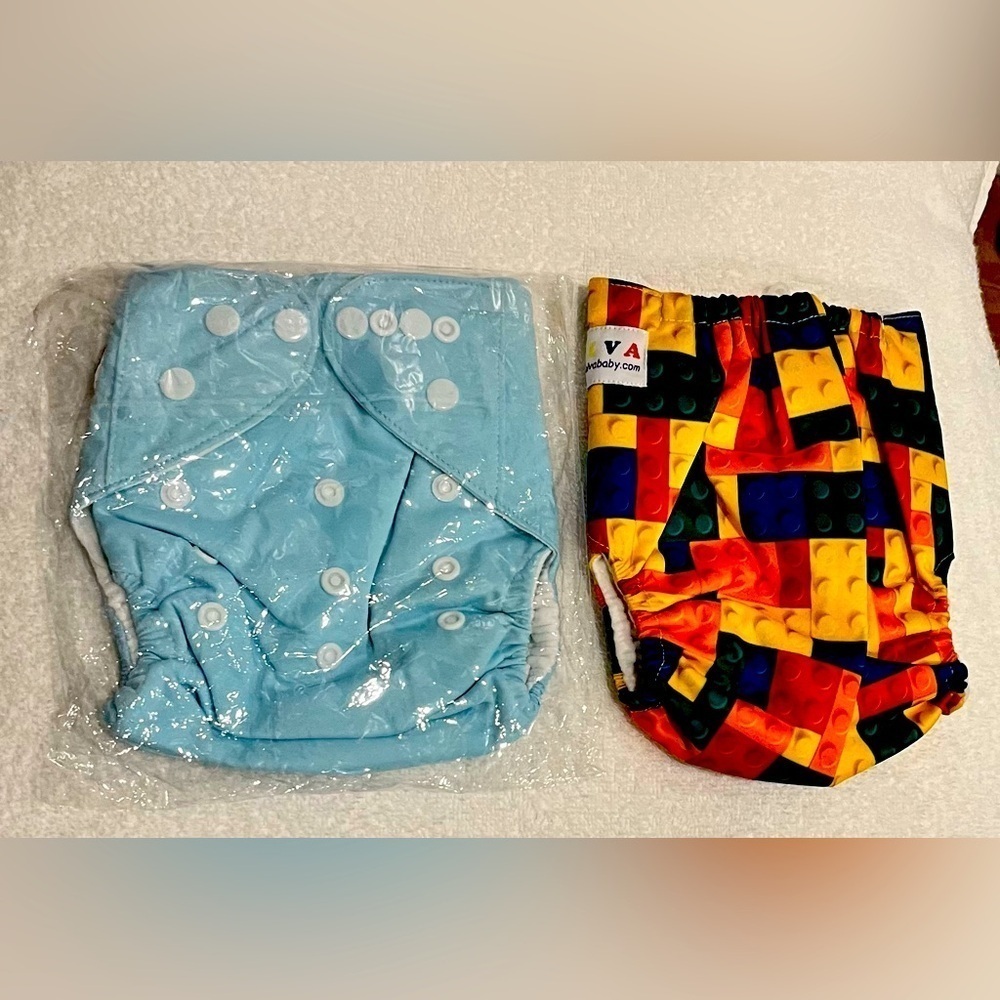 Two new never used diaper covers